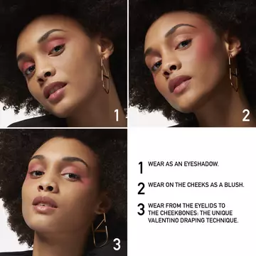A woman wearing Valentino Beauty Eye2Cheek Blush and Eye Shadow on her eyes, cheeks, and cheekbones.