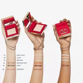 Valentino Beauty Go-Clutch Refillable Compact Powder swatched on fair, medium, and deep skin. 