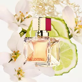 Valentino Beauty Voce Viva Eau De Parfum surrounded by bergamot and vanilla bean