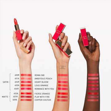 Swatches of Rosso Valentino Refillable Lipstick on fair, medium, and dark skin 