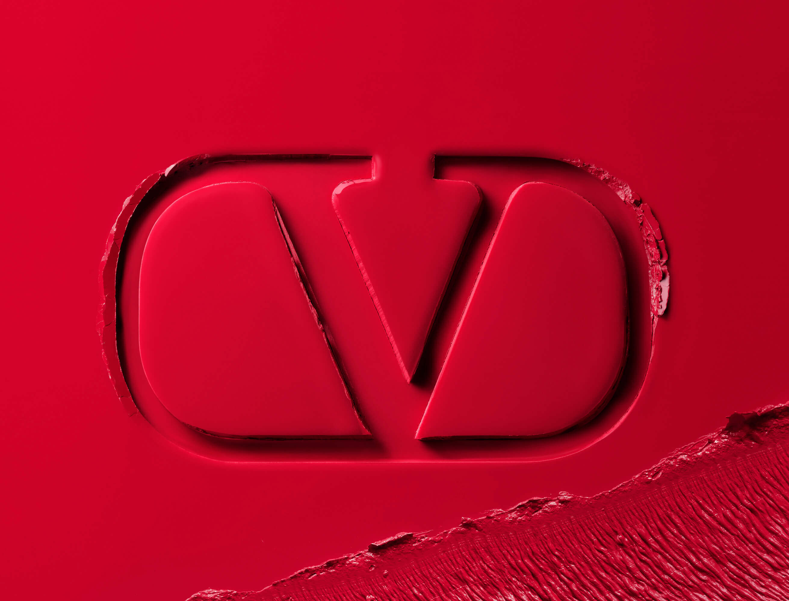 Valentino Beauty logo embossed in red lipstick