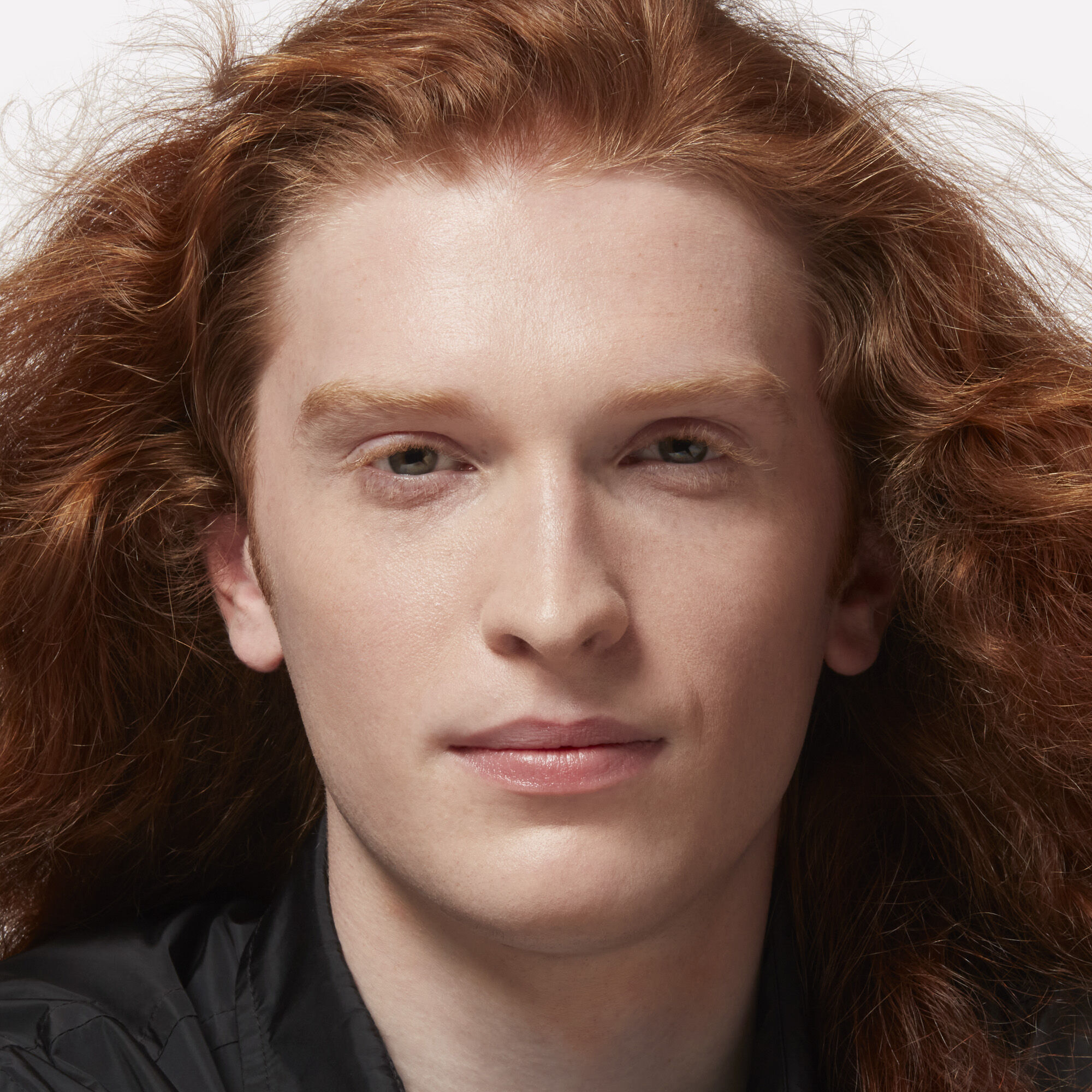 Man with fair skin and long red hair