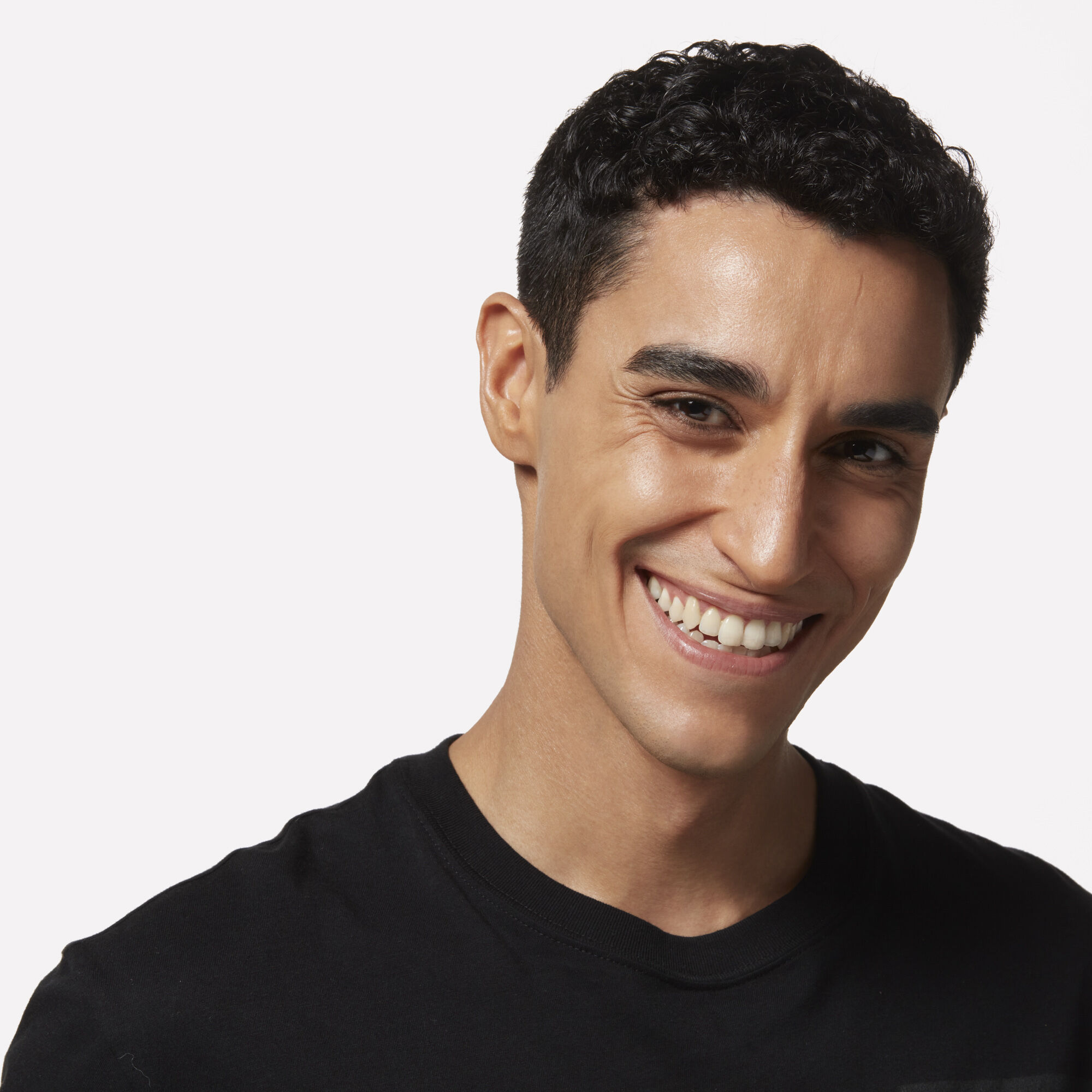 Smiling man with short brown hair