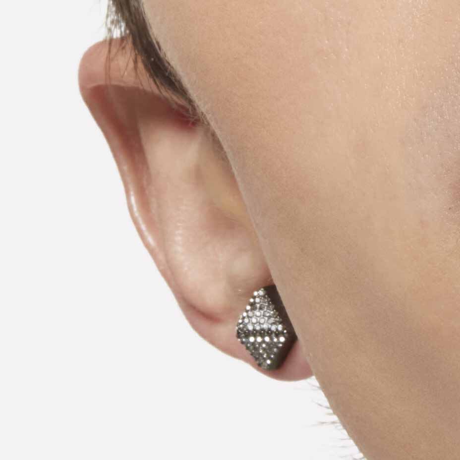 Close-up of an ear lobe and sideburns with diamond stud earring
