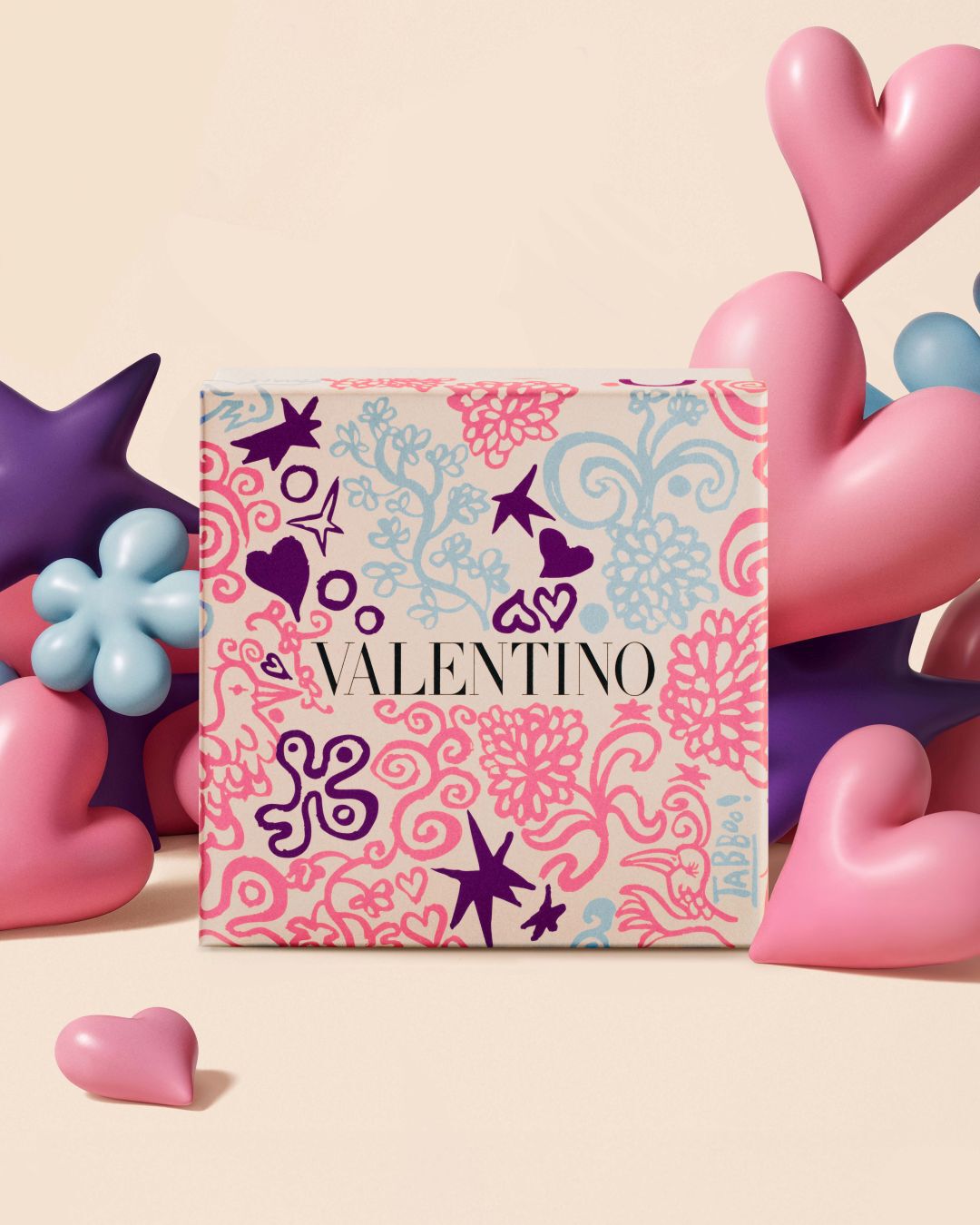 Valentino gift set in front of star and heart balloon shapes