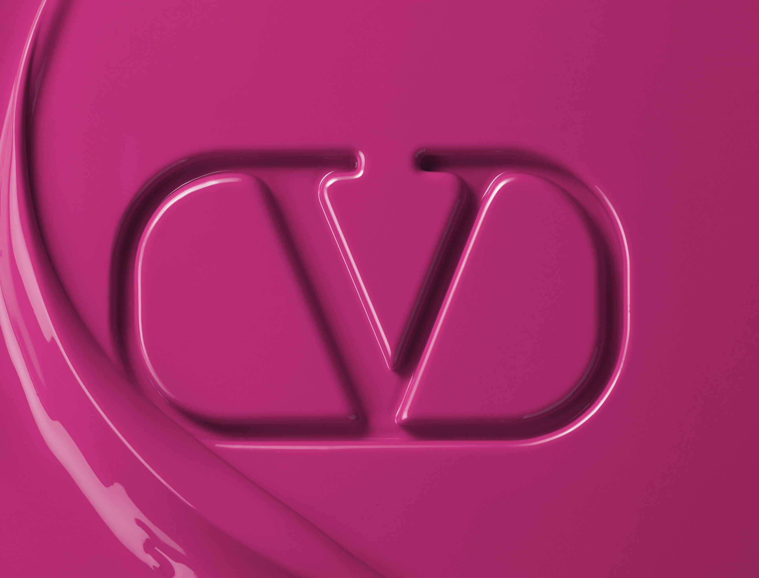 Valentino Beauty logo embossed in magenta lipstick formula