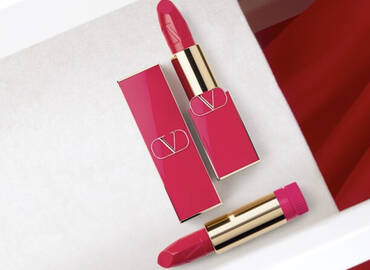 A flat lay of two red Rosso Valentino Refillable Lipstick