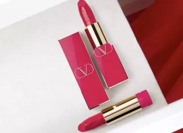 A flat lay of two red Rosso Valentino Refillable Lipstick