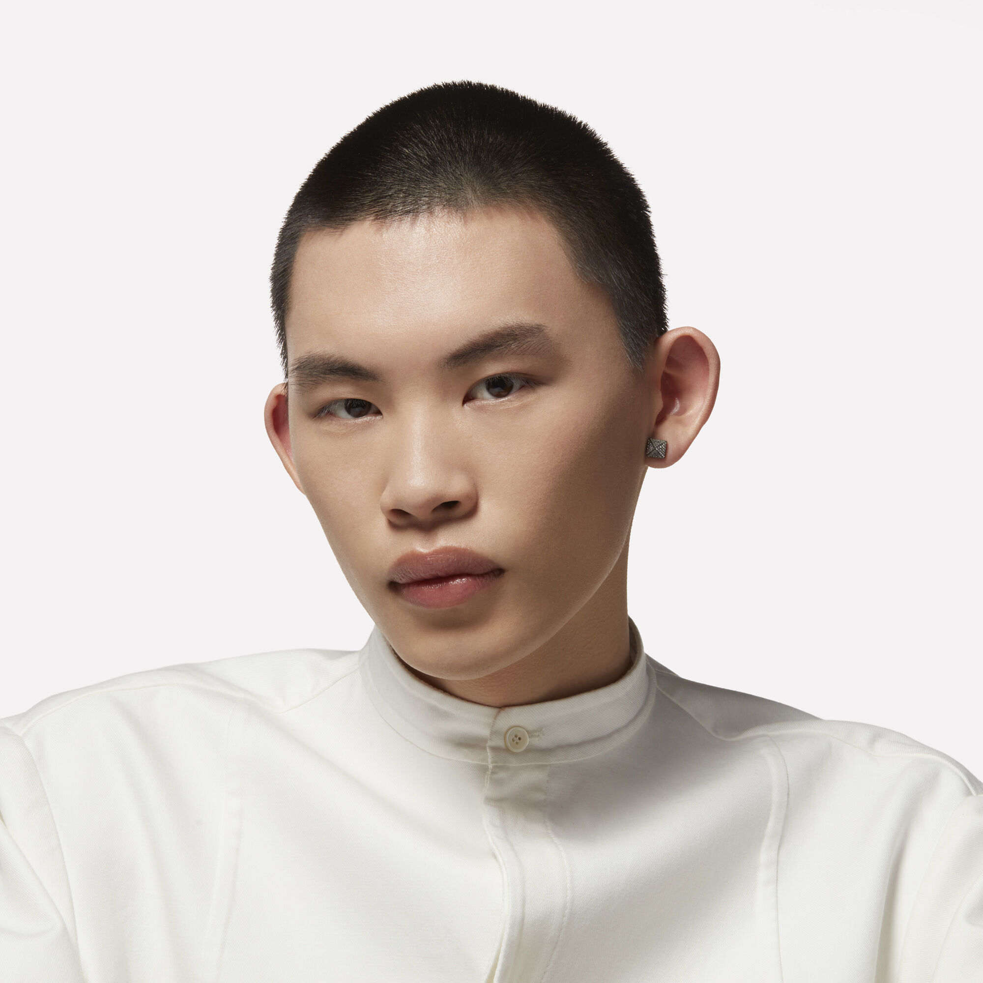 A model with a buzz cut